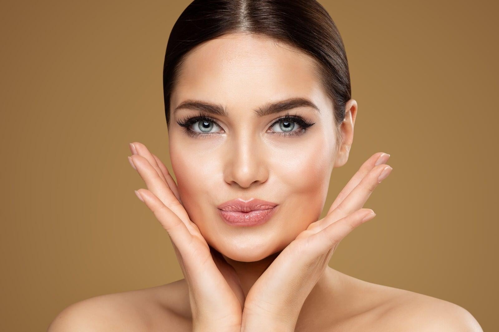 A lady cupping her face in her hands